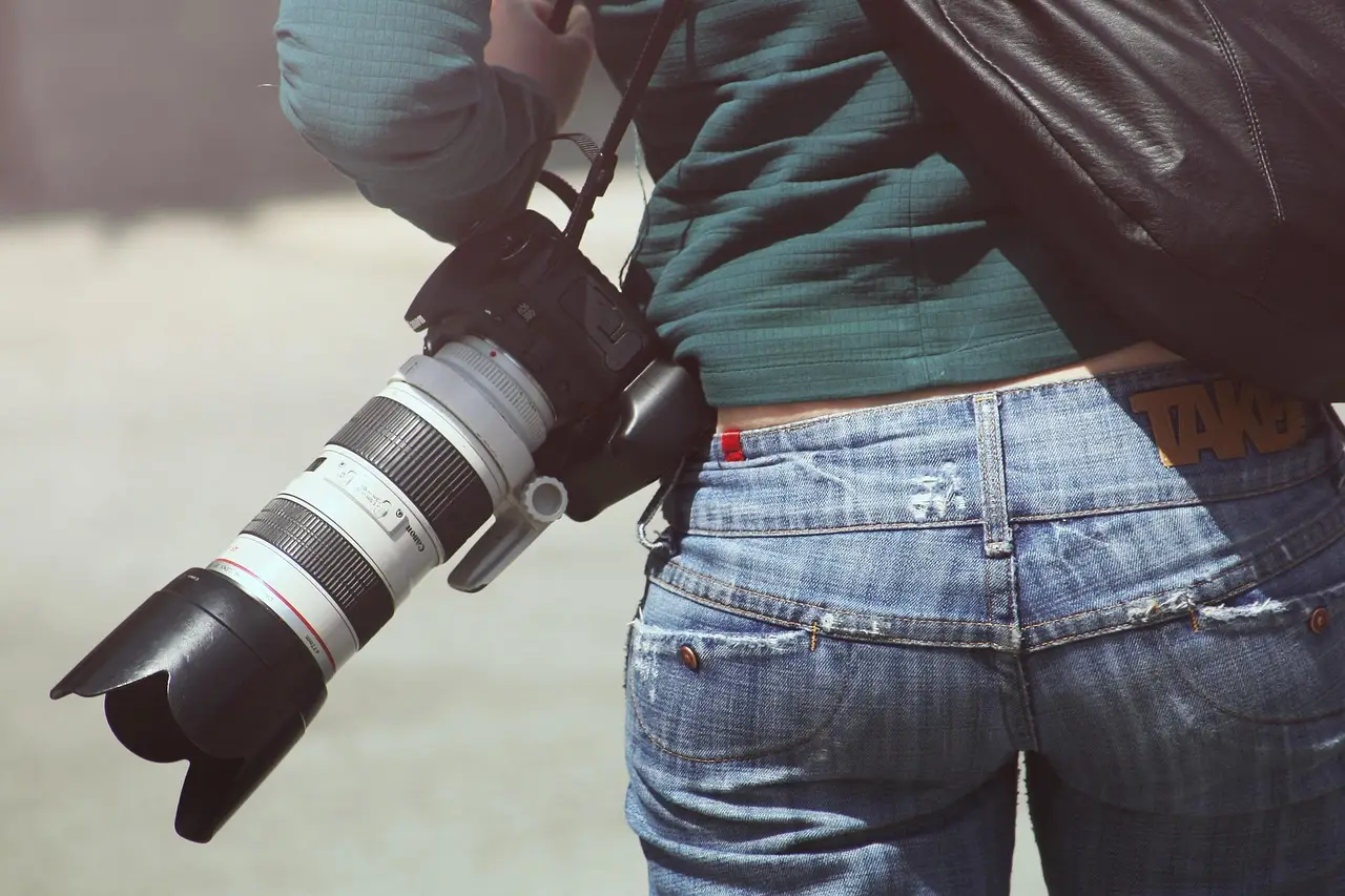 woman, photographer, camera, digital camera, dslr, slr, behind, bottom, back, canon, girl, lens, photography, camera lens, equipment, professional, jeans, casual